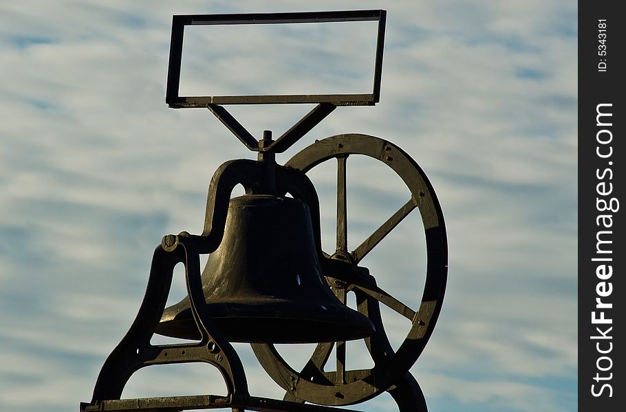 An old bell mounted on a store in Old Town San Diego, California. An old bell mounted on a store in Old Town San Diego, California