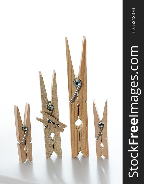 A wooden clothespin family (2 parents and 3 children). A wooden clothespin family (2 parents and 3 children)