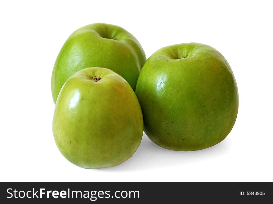 Three green apples are on a white background. Three green apples are on a white background