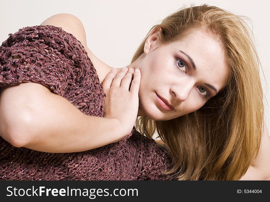 Beautiful blond with hand on her neck. Beautiful blond with hand on her neck