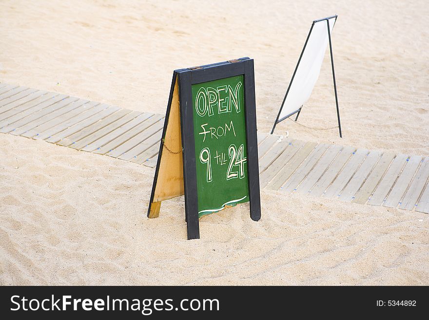 A photo of Beach bar board with opening hours