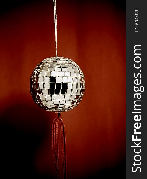 retro mirror ball with red background