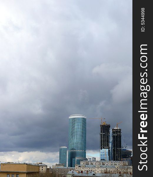 New buildings in Moscow. Construction. Clouds.