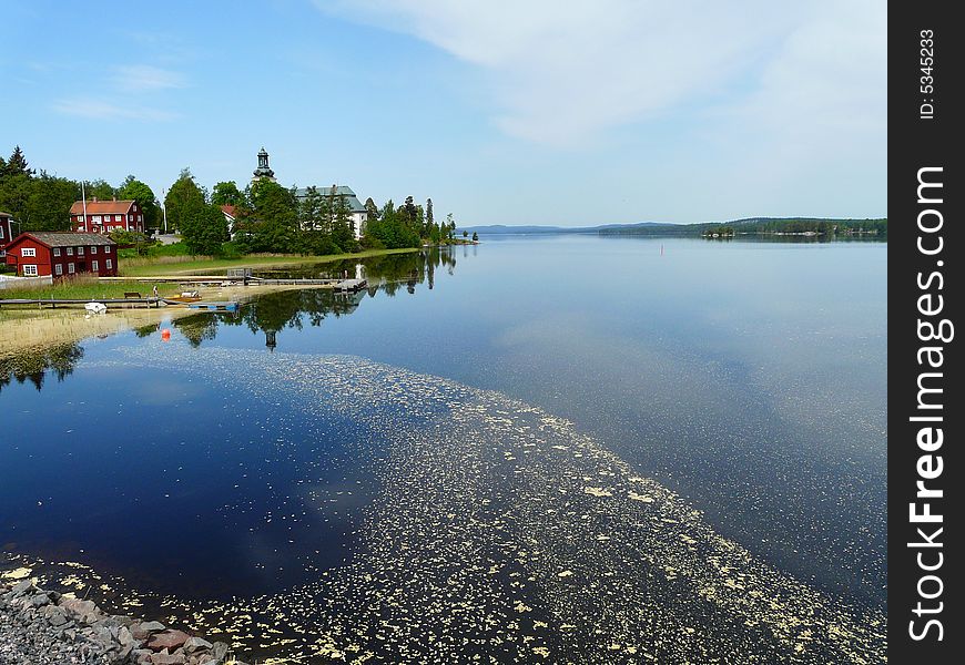 A swedish village by blue lake. A swedish village by blue lake.