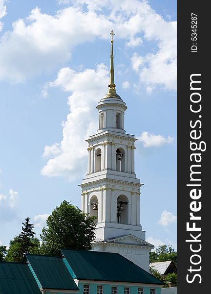 White bell tower against a background of blue sky