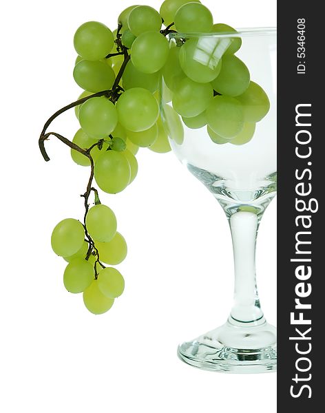 Green grapes in wine glass