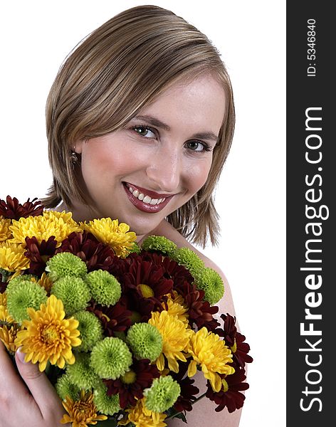 Beautiful blonde woman with bright makeup holding a bunch of flowers. Beautiful blonde woman with bright makeup holding a bunch of flowers