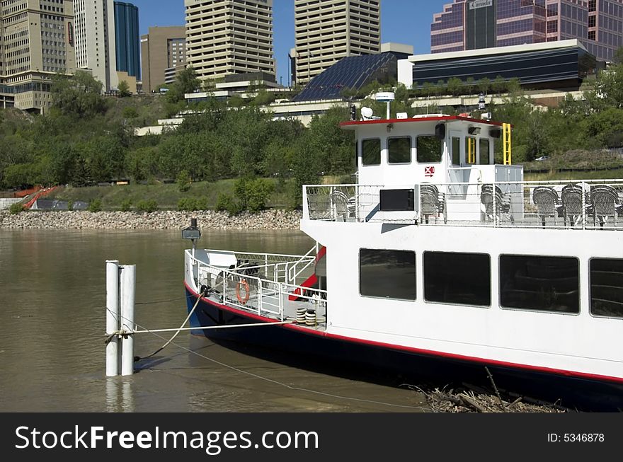 Skyscrapers and river boat in Edmonton Alberta's city center.