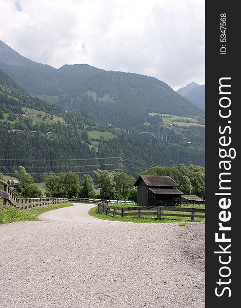 Mountain pass with houses and fields