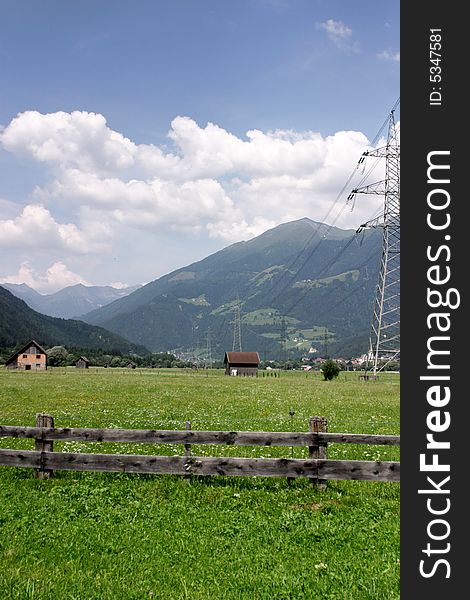 Mountain pass with houses and fields