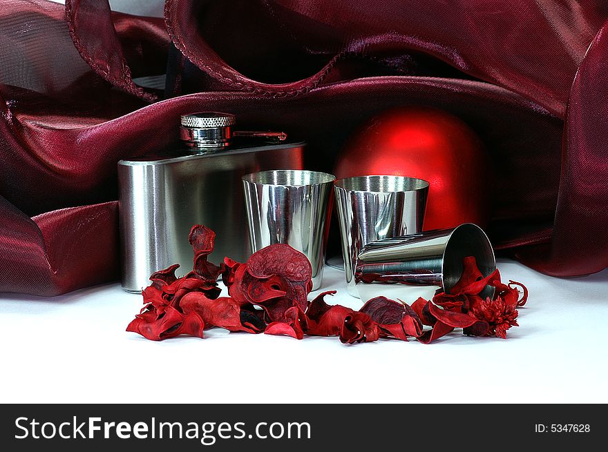 Still life in crimson tints with shpere, flask, still cups, colored dried plants, drapery and other objects. Still life in crimson tints with shpere, flask, still cups, colored dried plants, drapery and other objects