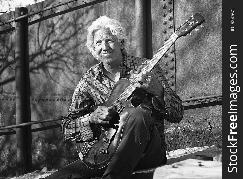 Guitar player with his instrument