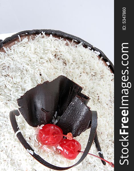 Chocolate cake with grated white chocolate on it