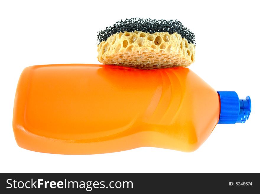 Detergent in orange plastic bottle and sponge on isolated background. Detergent in orange plastic bottle and sponge on isolated background