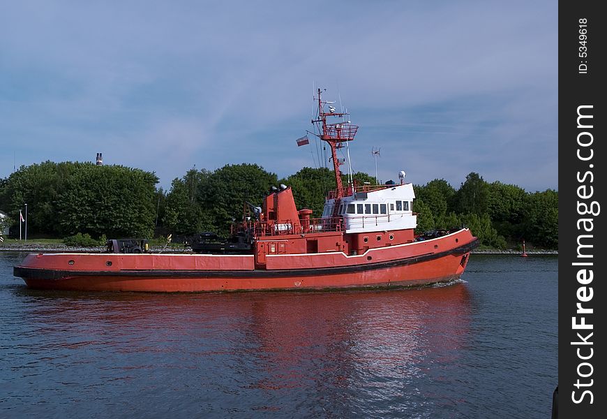 A huge tugboat in a harbor. A huge tugboat in a harbor