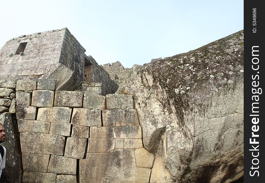 The lost city of the inca Machu Picchu in Cuzco, Peru. Inca window. inca window in the left.