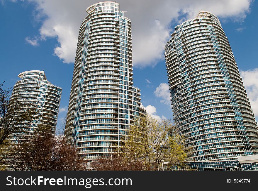 Wideangle shot of three modern residential towers in Toronto