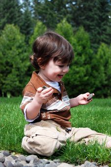 Little Boy Playing Outside Royalty Free Stock Images