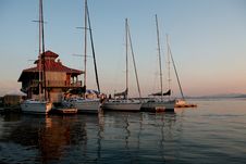 Sail Boats Lined Up At A Marina In A Lake Stock Photos