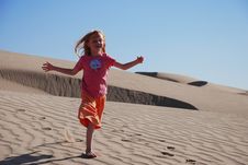 Young Girl Playing On Sand Dunes Royalty Free Stock Photo Young Girl Playing On Sand Dunes Royalty Free Stock Photo