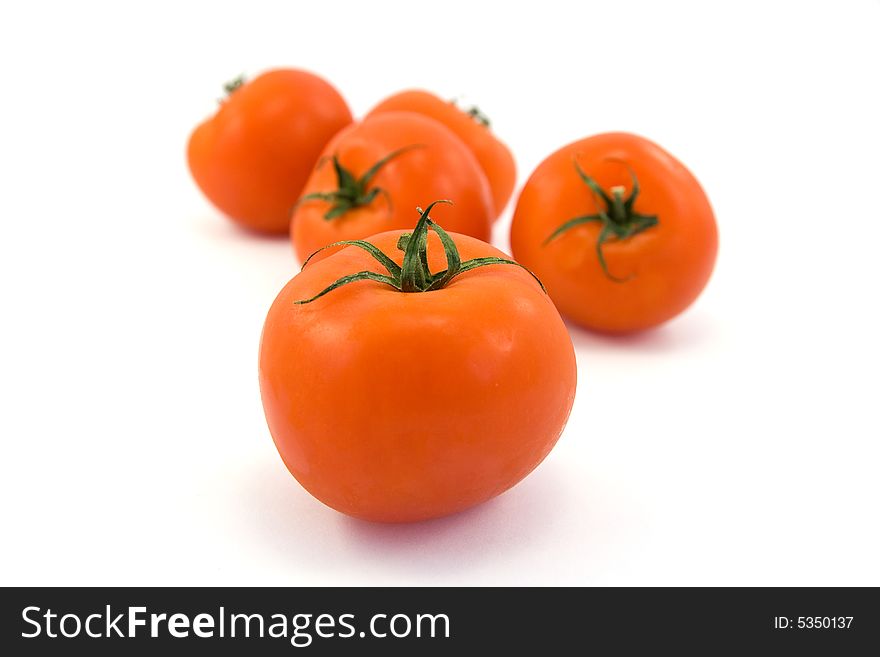 Red tomatos isolated on white. Red tomatos isolated on white