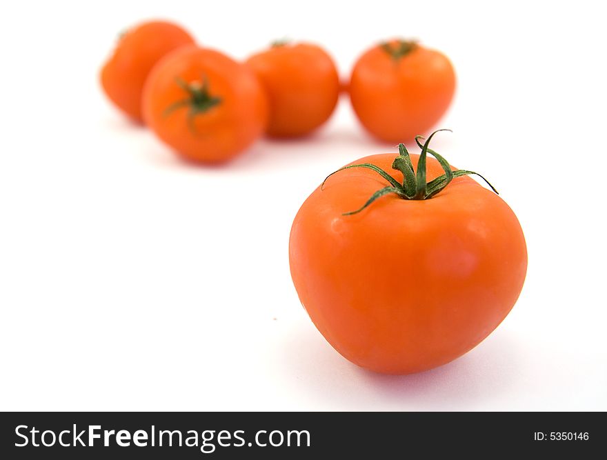 Red tomatos isolated on white. Red tomatos isolated on white