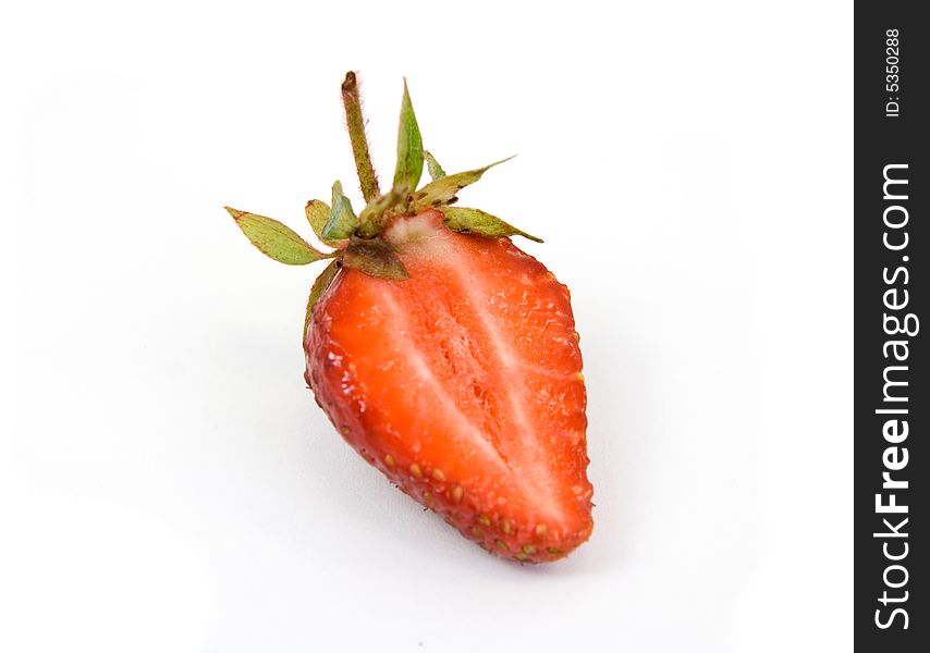 Cut strawberry isolated on white