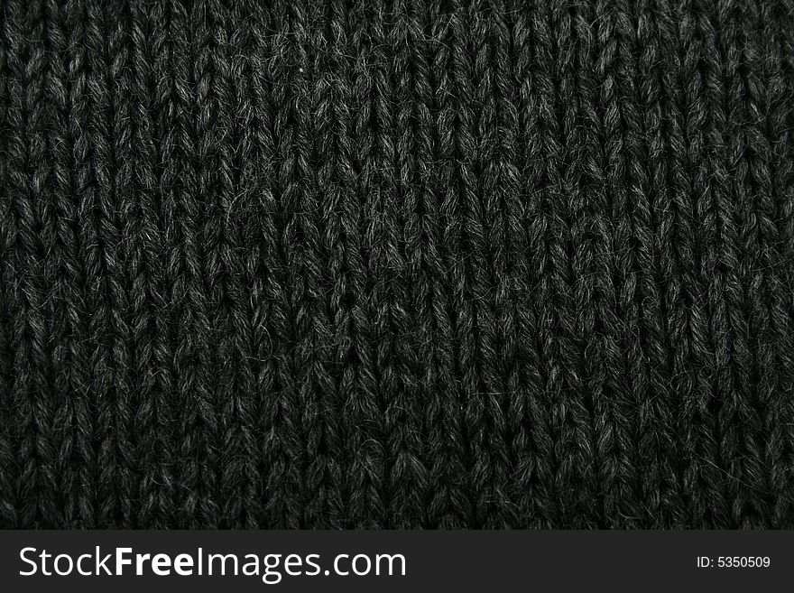 Texture of knitted green and beige cloth. Texture of knitted green and beige cloth