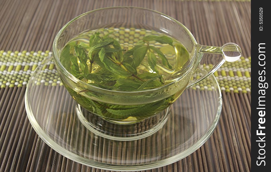 Transparent cup of a herbal mint tea