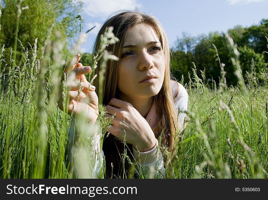 Portrait of young girl on meadow