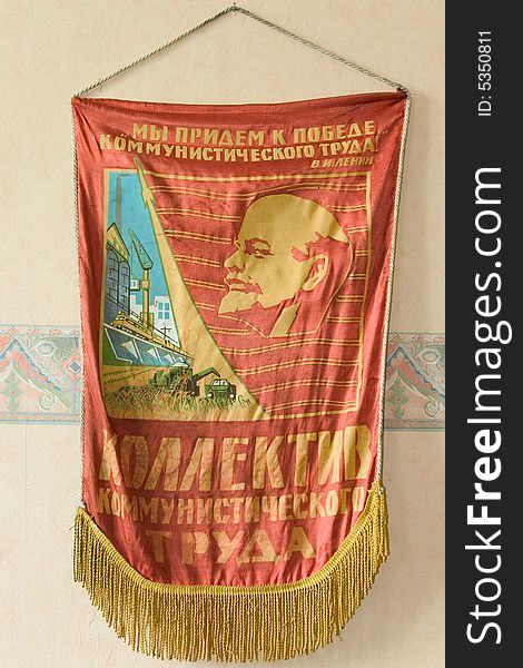 A red pennant of Lenin and collective comunist labour.