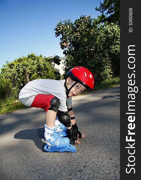 Young boy roller - blading outdoor