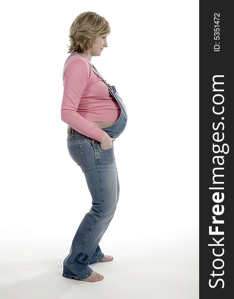 The pregnant woman on a white background