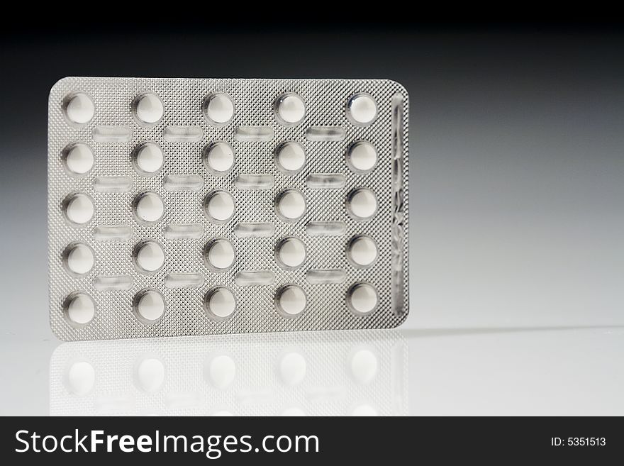 White pills pack isolated over white background