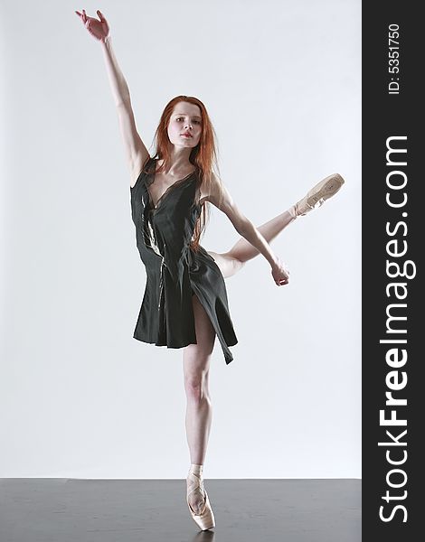 Young thin female ballerina on pointe