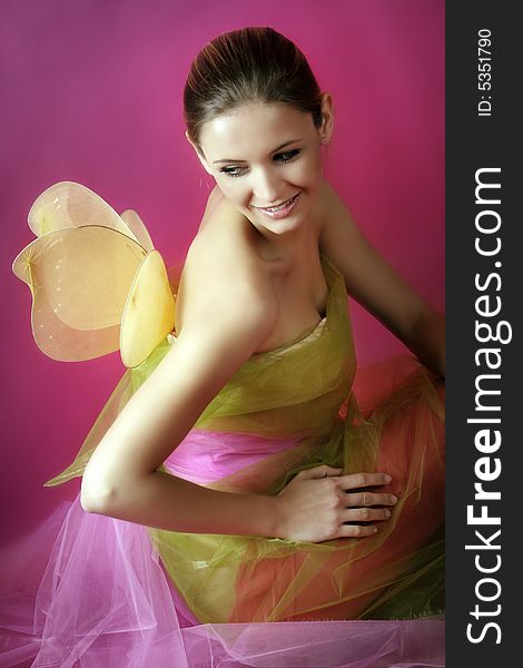 Fashion and beauty portrait of a young woman with wings. Fashion and beauty portrait of a young woman with wings