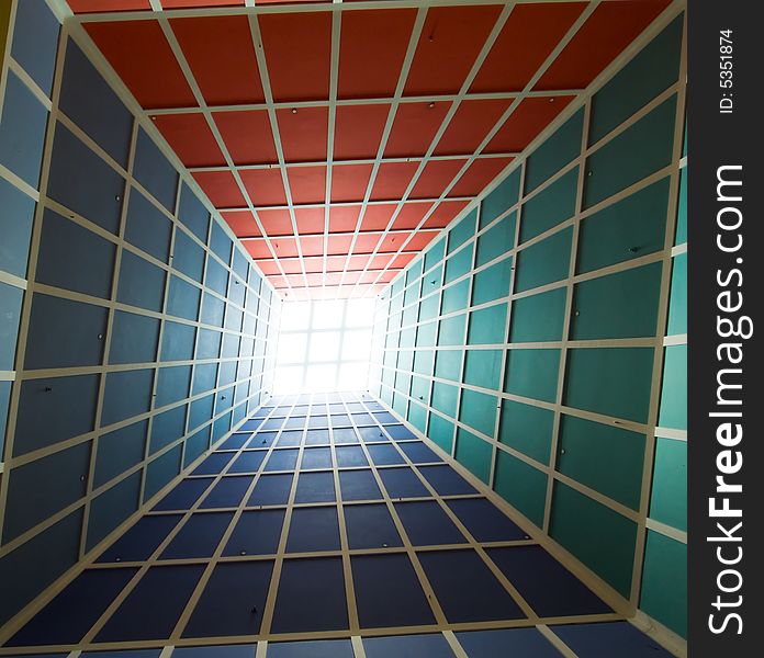 Tapering pyramid ceiling with skylight in the interior of a modern building