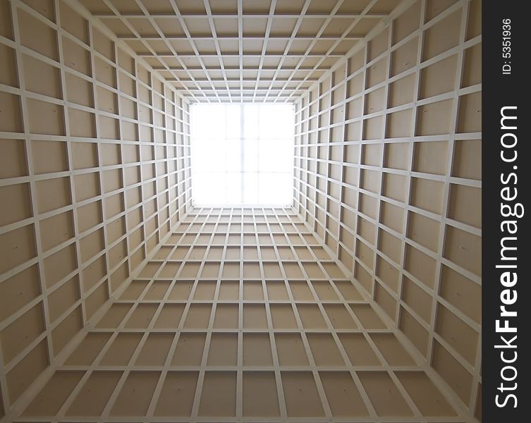 Tapering pyramid ceiling with skylight in the interior of a modern building