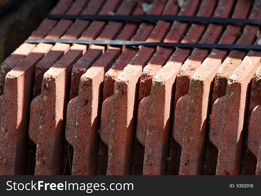 Shot of a tied bundle of red roof tiles. Shot of a tied bundle of red roof tiles