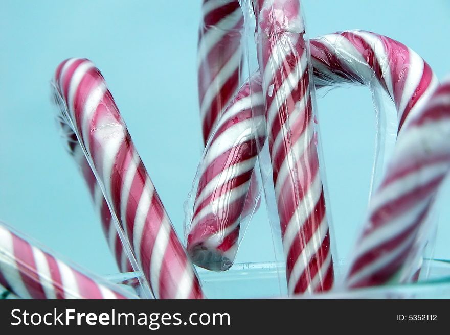 Candy Canes Isolated On Blue