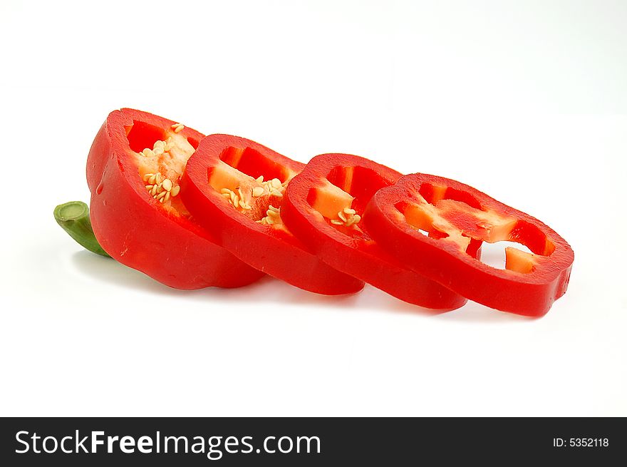 Cut slices pepper in white  background. Cut slices pepper in white  background