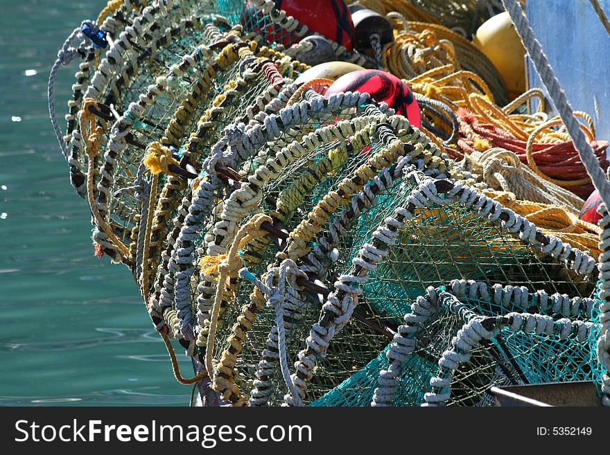 Fishing baskets tied to fishing vessel at Kalk Bay Harbour