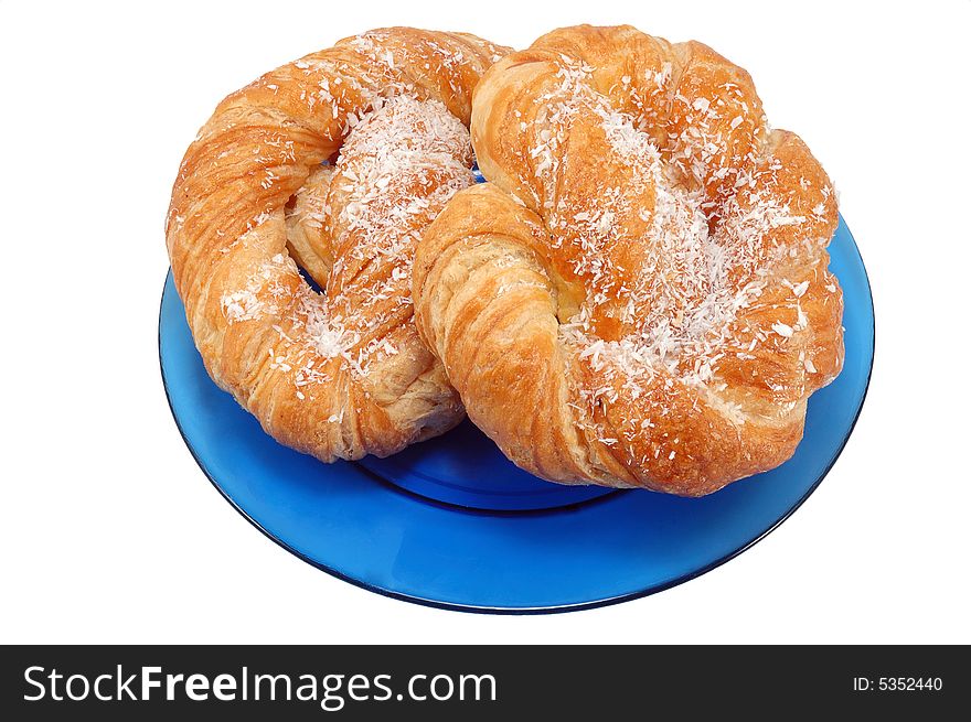 Bakery on blue plate isolated