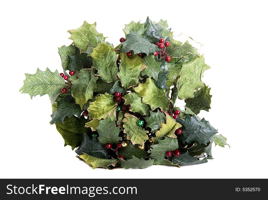 A christmas display of green holly and red berries. A christmas display of green holly and red berries