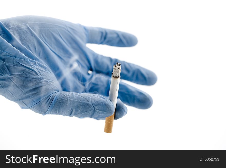 Glove of a doctor with a cigarette. Glove of a doctor with a cigarette