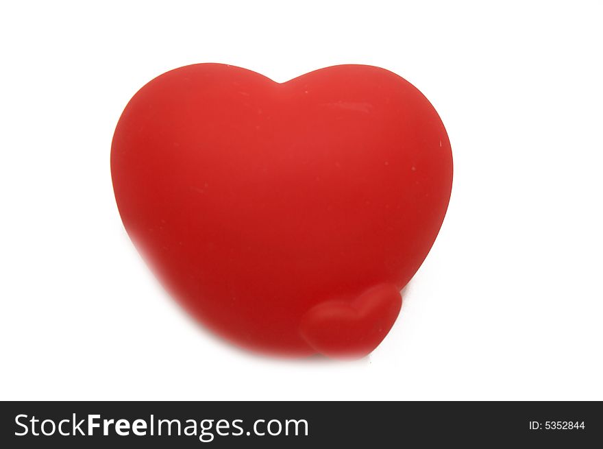 Soft red heart isolated on white