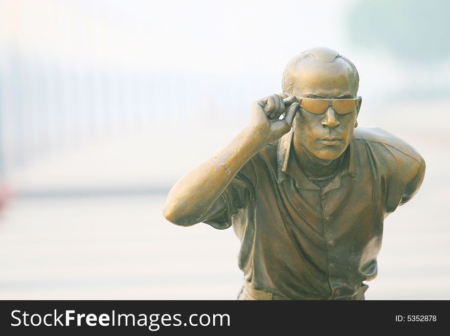 The skate man on a garden .this is a modern statuary