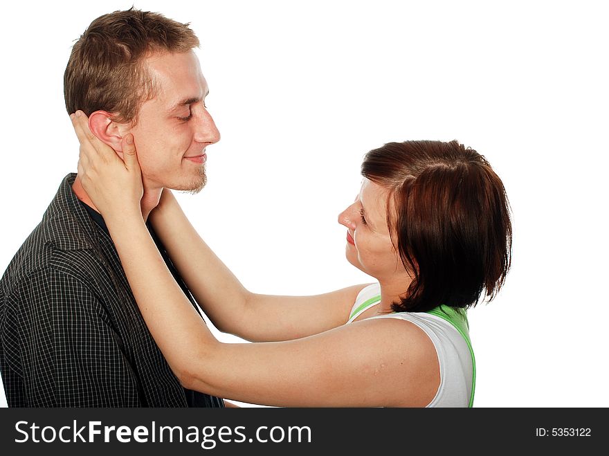 Young loving couple on white background