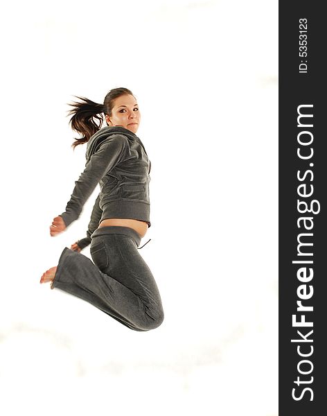 Active woman jumping on white background. Active woman jumping on white background