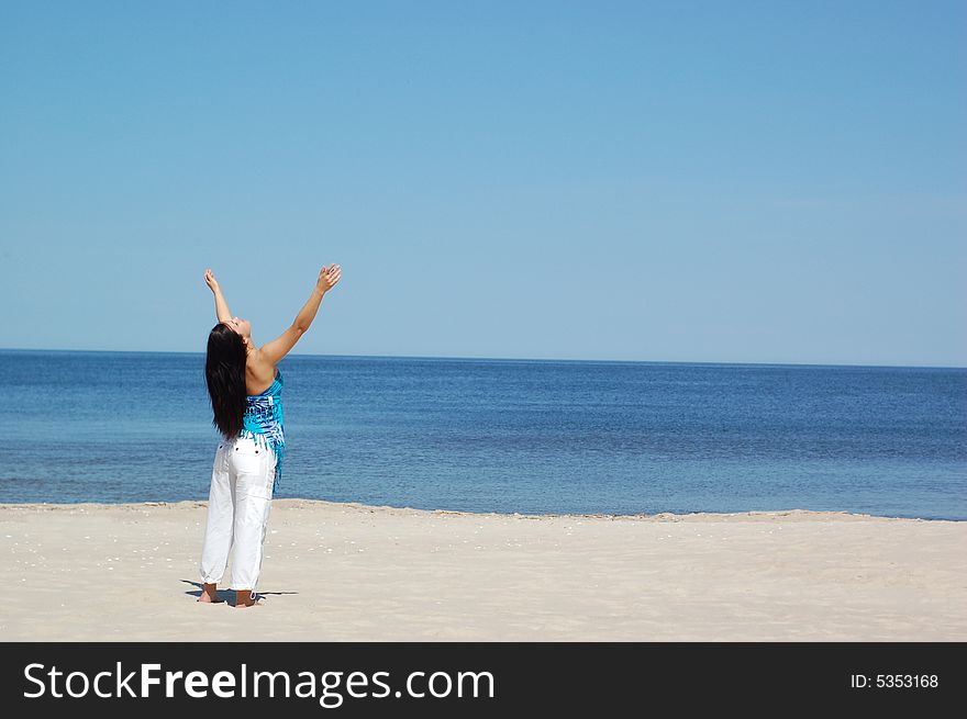 Woman doing exercise on the beach. Woman doing exercise on the beach